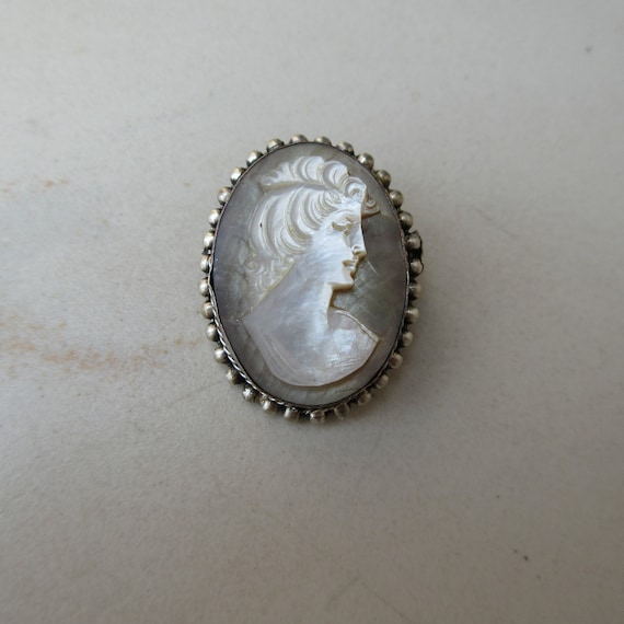 Mother of pearl cameo brooch deals