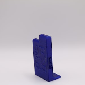 May include: A blue plastic 3D printed object with the text "Additive" and "68mm" on it.
