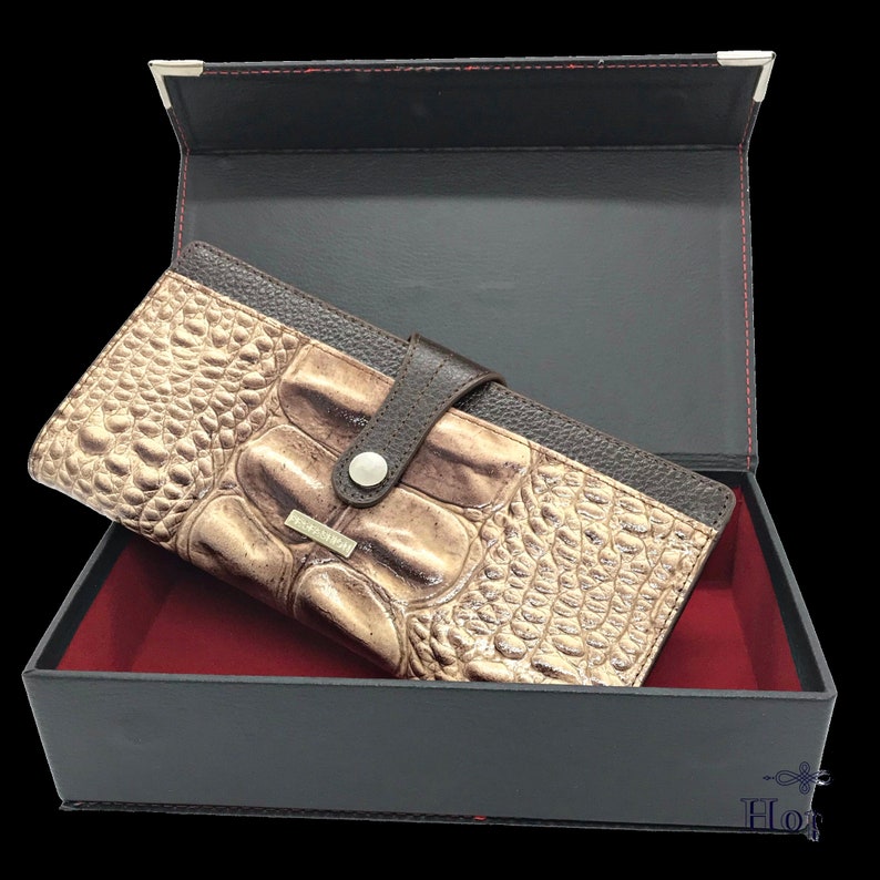 an open box with a wallet inside of it