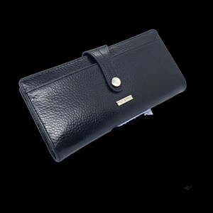 a black leather wallet on a black background
