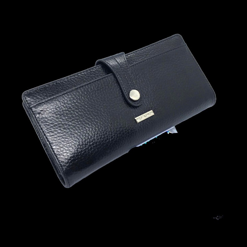 a black leather wallet on a black background