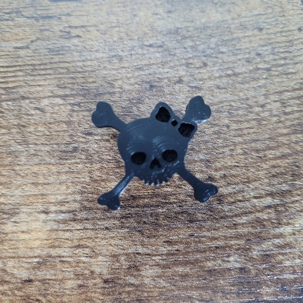 Skull and Crossbones with Bow Tire Valve Stem Cap. Available in several Colors. 3D printed with Eco Friendly Material. Schrader Valve Stems.