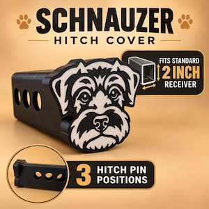 May include: A black hitch cover featuring a white Schnauzer dog face graphic. The text reads SCHNAUZER HITCH COVER, FITS STANDARD 2 INCH RECEIVER, and 3 HITCH PIN POSITIONS. The device has three circular holes along the side for pin placement.
