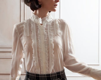 Blusa vintage bianca trasparente con volant (jabot) e maniche lunghe, taglia M