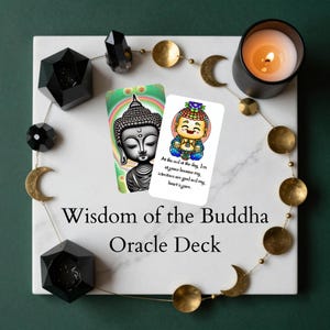 May include: A Wisdom of the Buddha Oracle Deck is presented on a white marble surface, with decorative elements. The deck features cards with Buddha illustrations and text. A lit candle and decorative beads complete the scene.