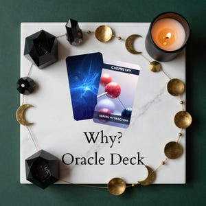 May include: An oracle deck with the words "Why? Oracle Deck" on a white marble surface. The deck includes two cards, one with a blue abstract design and the other with a molecular structure and the words "Chemistry" and "Sexual Attraction". The scene is decorated with a lit candle, crystals, and gold accents.