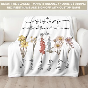 May include: White throw blanket with a floral design and the text "sisters are different flowers from the same garden". The names Emily, Amanda, Olivia, Ashley, Avery, and Weston are written vertically on the blanket.