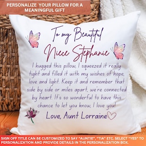 May include: White personalised cushion with text, butterflies, and a lotus flower. The cushion reads "To my Beautiful Niece Stephanie" with a heartfelt message from Aunt Lorraine. A meaningful gift.