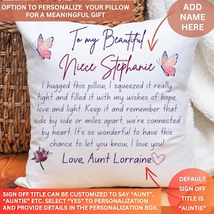 May include: White personalised cushion with text: "To my Beautiful Niece Stephanie." Features butterflies and a lotus flower design. Text reads: "Love, Aunt Lorraine." Option to add a name.