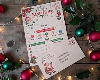 May include: A printed letter template titled A Letter to Santa Claus with fillable fields for name, age, and behaviour, alongside a matching envelope addressed to Santa Claus at Santa's Grotto, Reindeerland, XM4 5HQ, featuring Santa illustrations.