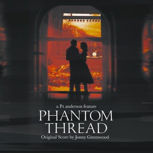 May include: A movie poster for the film "Phantom Thread" featuring a silhouette of a couple in a dimly lit room. The title of the film is in large, bold letters and the text "a P.t anderson feature" is above the title. The text "Original Score by Jonny Greenwood" is below the title.