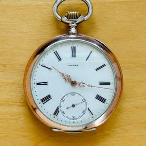2T626 Antique Omega silver pocket watch, popular enamel dial with roman numerals