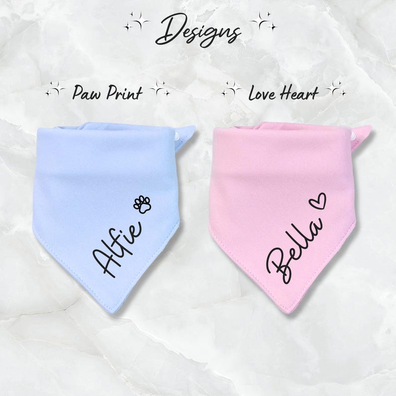 May include: Two personalized dog bandanas, one light blue with a paw print and the name "Alfie" and one pink with a heart and the name "Bella".