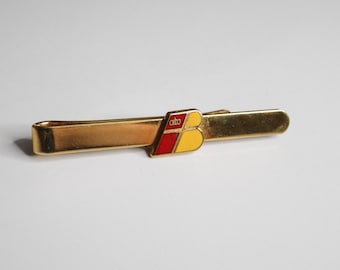 Vintage Gold-Tone Tie Slide with Red & Yellow Emblem