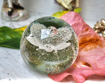 Caithness large vintage paperweight with magnificent floating sparkling flower in a clear bubbled glass