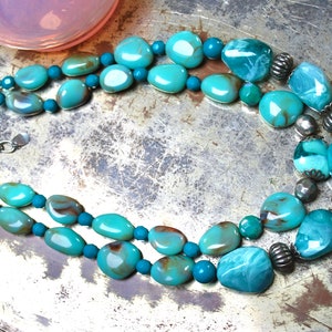 Statement fashion necklace from designer beads in turquoise blue colour