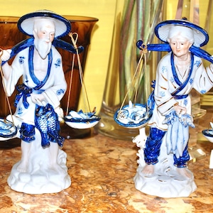 Vintage pair of stylish figurines of a Chinese fisherman and his wife decorated in blue and gold made in Taiwan