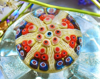 Strathearn glass paperweight with millefiori and twisted canes in bright colours made in Scotland