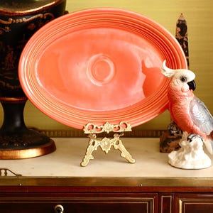 Collectable American ceramic plate in a beautiful coral colour by famous company Fiesta USA