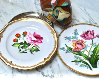 Spode pair of large display bone china plates hand painted with English garden flowers and bordered with liquid gold