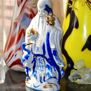 Vintage Chinese ceramic statue of a dignitary hand painted in blue and gold