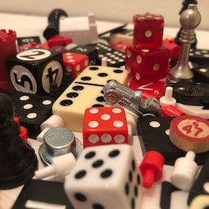 Classic Board Game Pieces in Black, Red and Cream.