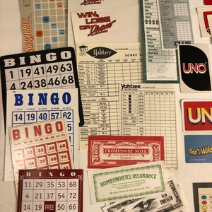 May include: A collection of vintage board game cards and pieces, including Bingo cards, Yahtzee scorecards, Clue suspect and weapon cards, and a Monopoly promissory note. The cards are in various colors, including red, green, blue, and yellow.