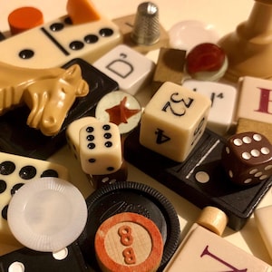 40 Vintage Game Pieces. Pawns, players and dice from classic games. 10 vintage game cards.