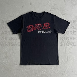 May include: Black t-shirt with the text "O.R.B." in a distressed red font. Below the text is "BROUGHT TO YOU BY LUCK!" in white. The shirt is made of a soft material and has short sleeves.
