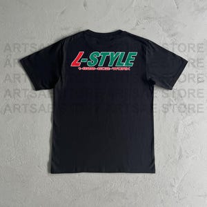 May include: Black t-shirt with a green and red logo that says "L-STYLE" and "1-800-GO2-WORK".