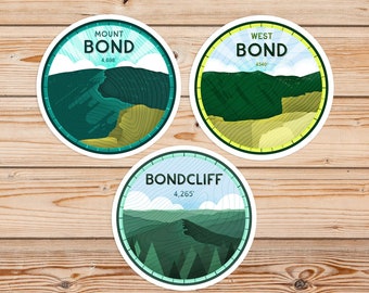May include: Three round stickers with white borders and green mountain illustrations. The stickers feature the names "Mount Bond", "West Bond", and "Bondcliff" with their respective elevations in feet.