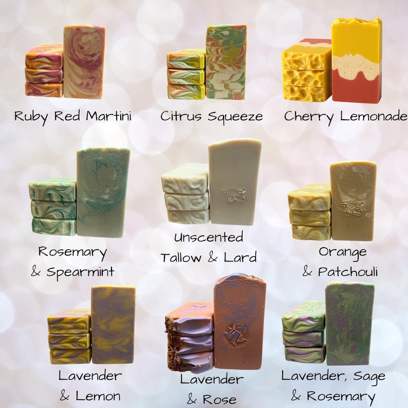 May include: Nine rectangular bars of soap arranged in groups of three, each labeled with names including Ruby Red Martini, Citrus Squeeze, Cherry Lemonade, Rosemary & Spearmint, Unscented Tallow & Lard, Orange & Patchouli, Lavender & Lemon, Lavender & Rose, and Lavender, Sage & Rosemary.