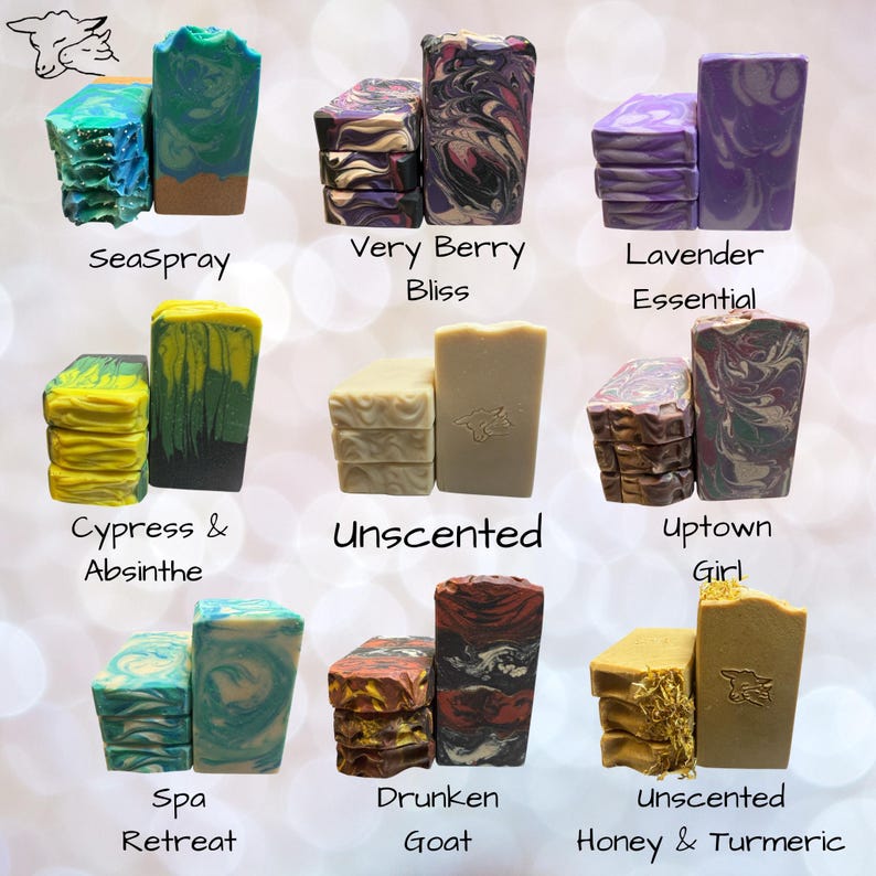 May include: A collection of nine varieties of rectangular soap bars, each labeled with names including SeaSpray, Very Berry Bliss, Lavender Essential, Cypress & Absinthe, Unscented, Uptown Girl, Spa Retreat, Drunken Goat, and Unscented Honey & Turmeric.