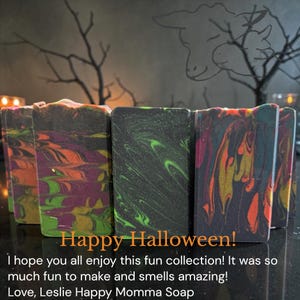 May include: Rectangular bars of soap featuring a marbled design in black, orange, purple, and neon green. The text on the image reads: Happy Halloween! I hope you all enjoy this fun collection! It was so much fun to make and smells amazing! Love, Leslie Happy Momma Soap.