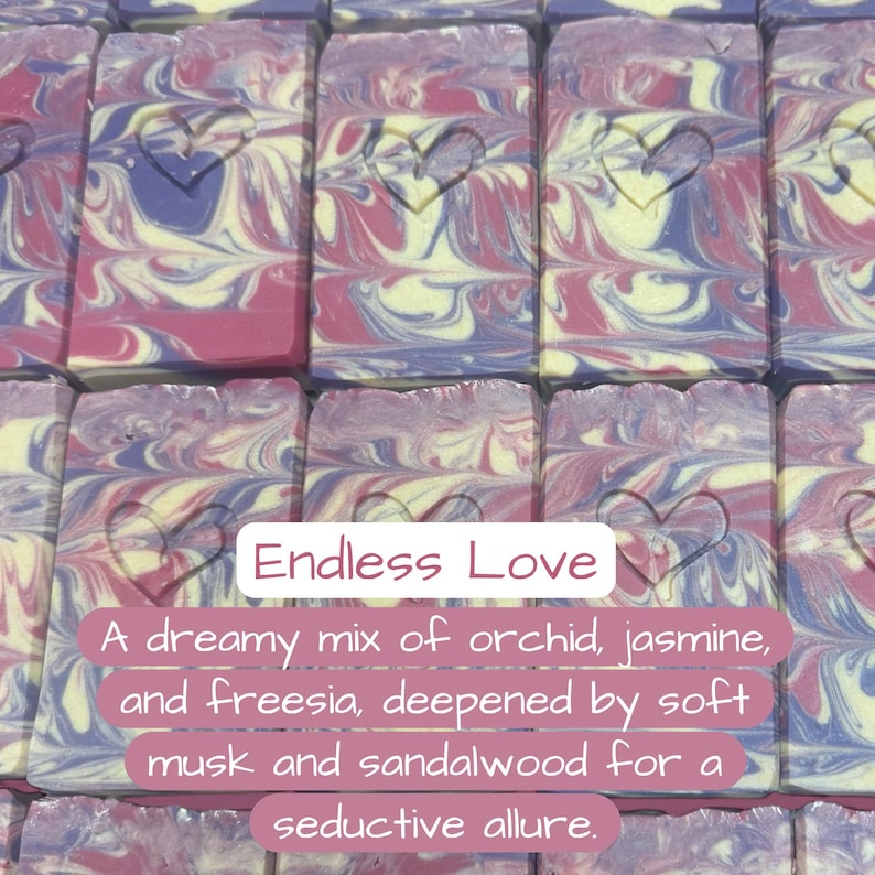 May include: Artisan soap bars with a heart design carved into the top. The soap features a swirl of pink, purple, and cream colors. The text "Endless Love" is displayed on the image, along with a description of the scent.