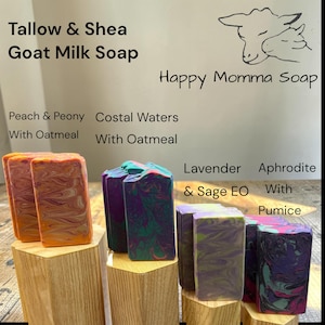 May include: Four rectangular bars of Tallow & Shea Goat Milk Soap by Happy Momma Soap. Varieties include Peach & Peony with Oatmeal, Coastal Waters with Oatmeal, Lavender & Sage EO, and Aphrodite with Pumice, each featuring unique marbled color swirls.