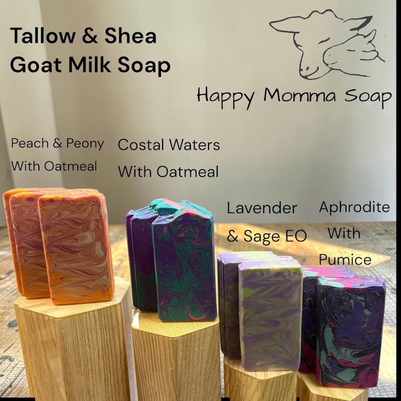May include: Four rectangular bars of Tallow & Shea Goat Milk Soap by Happy Momma Soap. Varieties include Peach & Peony with Oatmeal, Coastal Waters with Oatmeal, Lavender & Sage EO, and Aphrodite with Pumice, each featuring unique marbled color swirls.