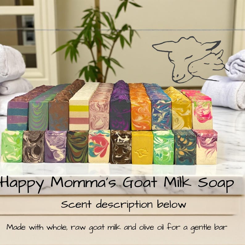 May include: A collection of colorful goat milk soaps with various patterns and swirls. The soaps are arranged in rows, showcasing a variety of colors including blue, brown, purple, and green. The text "Happy Momma's Goat Milk Soap" is visible.