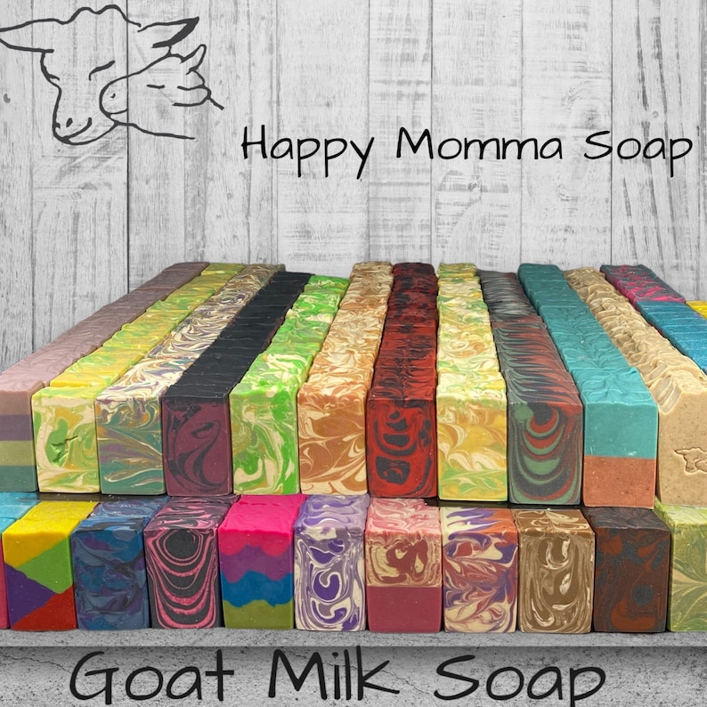 A gray table filled with colored and beautiful swirls and layered goat milk soap. This soap is cold process handmade bars made with fresh goat milk, coconut oil, eco-friendly palm oil, olive oil, hemp seed oil, sunflower oil, castor oil, kaolin clay, and aloe vera. They are 4 ounce bars with bubbly lather.