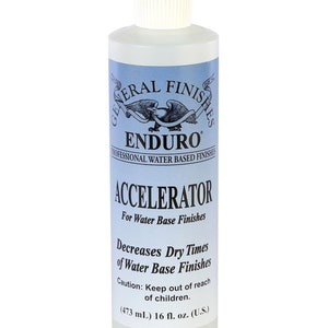 May include: A clear plastic bottle of General Finishes Enduro Accelerator for water-based finishes. The bottle is labeled with the product name, "Accelerator", and instructions for use. It is a 16 fluid ounce bottle.