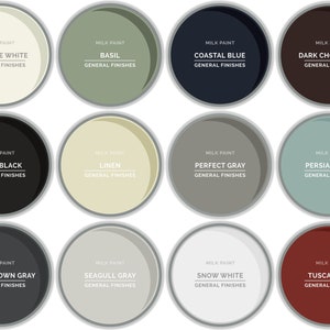 May include: Twelve paint can lids with different colors and names. The colors are antique white, basil, coastal blue, dark chocolate, lamp black, linen, perfect gray, persian blue, queenstown gray, seagull gray, snow white, and tuscan red.