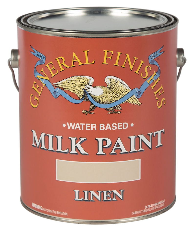 May include: A red paint can with a white eagle and blue ribbon logo. The can is labeled "General Finishes" and "Milk Paint" in black text. The paint color is "Linen".