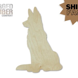 May include: A wooden cutout of a German Shepherd dog in a sitting position. The dog silhouette is made of light-colored wood, with visible wood grain. The logo "FORGED TIMBER COMPANY" is in the upper left corner. A brown starburst graphic with the text "SHIPS FAST" is in the upper right.