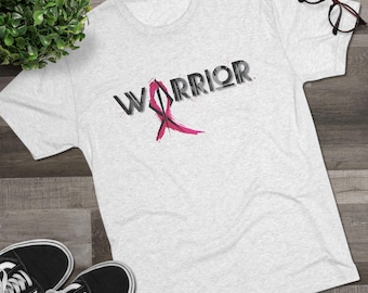 May include: A gray t-shirt with the word "WARRIOR" printed in black with a pink ribbon design.