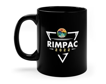 May include: Black ceramic mug with a white triangle design featuring the text "RIMPAC 2022" and a circular graphic of a seal with a sunset and a ship.