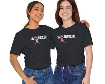 May include: Two people wearing black t-shirts with the word "WARRIOR" and a pink ribbon graphic. The shirts are a symbol of support for breast cancer awareness.