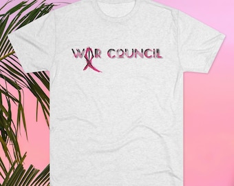 May include: A gray t-shirt with the text "WAR COUNCIL" printed in pink and black letters.