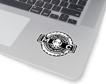 May include: A black and white sticker with a circular design. The sticker features a stylized octopus with the text "Malicious Compliance" around it.
