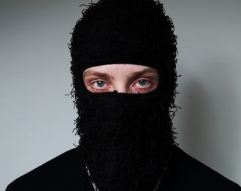 edgy and bold Distressed Black Balaclava, the iconic Shiesty aesthetic, this black distressed ski mask will elevate your style.
