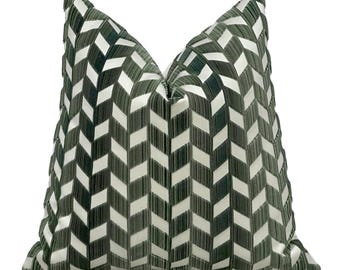 May include: A green and white geometric patterned throw pillow with a chevron design.